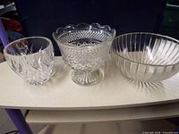 All three clear bowls side by side showing styles and size comparison