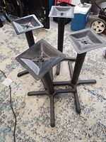 All four metal table bases grouped
