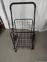 Front view showing full cart, basket and handle
