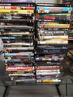 Overall view of three tall stacks of DVD cases