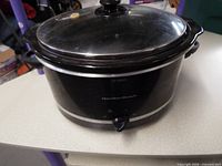 Front view of Hamilton Beach slow cooker showing control knob and brand logo