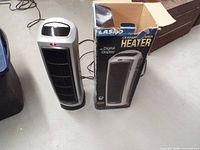 Heater standing next to original box, front grille and power cord visible