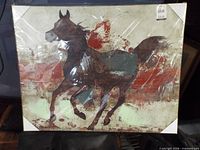 front view of framed horse print sealed in plastic