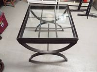 Angled overhead view showing full table, glass inset, grid pattern
