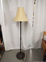 Full view of floor lamp with shade