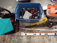 Overall view of lot showing totes, bins, leaf blower, levels and rope