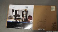 Front of sealed box showing Mainstays Writing Desk image and branding