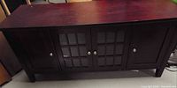 Front view showing entire cabinet, finish colour, four doors, overall wear