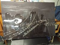 Front view of black & white skyline bridge canvas print