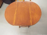 Top view showing drop-leaf surface and finish wear