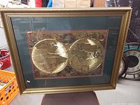 Front view of framed world map print showing full artwork, mat and frame