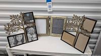 Full lot showing two Family Tree collage frames and two gold rectangular frames