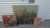 Group shot of three canvases showing relative sizes and designs