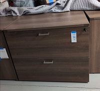 Front view of brown two-drawer lateral file cabinet