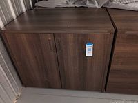 front view of closed cabinet showing handles and finish