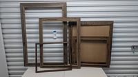 Front view of all four nested cedar frames showing size range and weathered finish