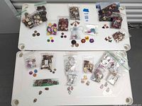 Overall view of both trays with bagged and loose buttons