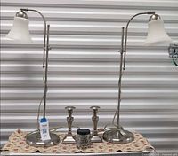Full view of both lamps, candlesticks, and candle showing overall condition