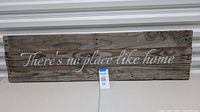 Full front view of reclaimed wood sign with phrase