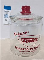 Full view of jar with lid showing graphics and shape