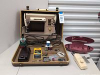 Overall view of Singer 301A in open case with all accessories laid out