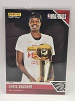 Front view of card showing Chris Boucher with trophy and Panini Instant NBA Finals design