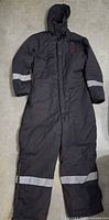 Full view of gray hooded coverall showing reflective bands and overall condition