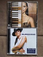 Front covers of both CD albums in cases