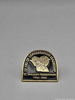 Front view of BC Wildlife Federation 1956–2006 gold-tone lapel pin showing design and text