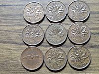 All nine coins obverse upward displaying years and maple leaf or dove designs