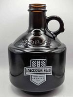 Front view showing 32 fl oz marking and brewery logo