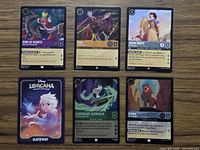 Six Lorcana cards arranged on table