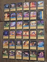 Full view of binder page showing 35 Disney Lorcana cards