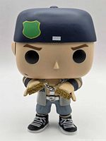 Front view of Funko Pop! John Cena figure showing face, cap, accessories