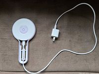 Lamp with cable and wall adapter laid out