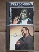 Front covers of both CD jewel cases