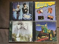Front cover view of all four CD jewel cases
