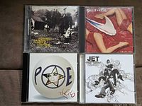 Front covers of all four CD albums