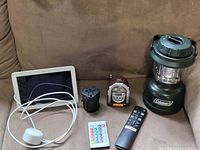 Group shot: smart display, lantern, remotes, adapter, jukebox radio