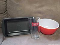 Group view of loaf pan, pint glass, mixing bowl