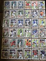 Thirty Topps Holiday insert baseball cards organized in sleeve pages