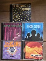 Front covers of all five jewel-cased CDs