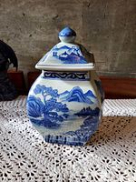 Full view of jar with lid showing landscape design