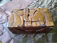 top view of elephant-carved wood box closed