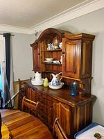 Teak hutch showing base drawers, doors and removable upper display with shelves