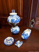 Full lot showing lamp, large clog, small clogs, cup set
