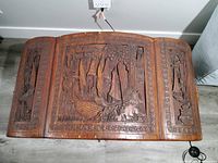 Top view showing carved nautical scene panels on lid