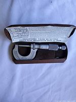 Micrometer in case with leaflet visible