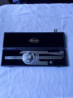 Protractor inside open black case