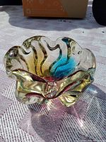 Top angled view showing rainbow swirl and scalloped rim